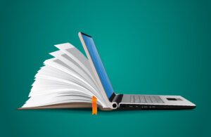 book merging into a laptop on a green background